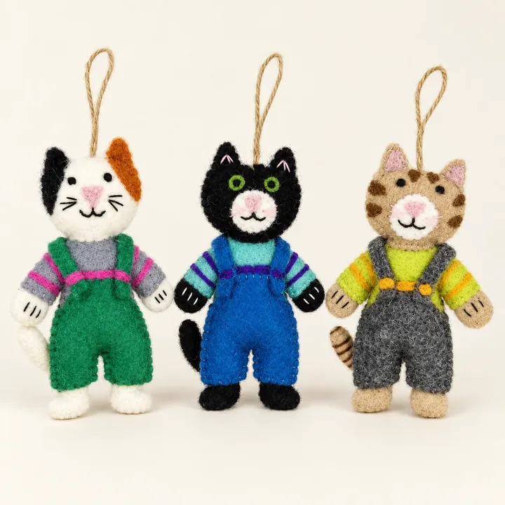 AI studio recreation: Cats in overalls in handmade wool felt on a warm ivory background