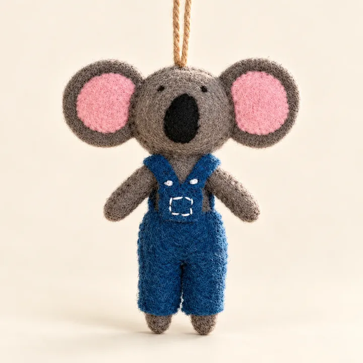AI studio recreation: Koala in overalls in handmade wool felt on a warm ivory background